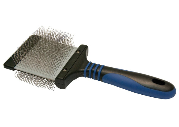 Show Tech Twin Flex Slicker brush with wire pin head and blue/black handle, angled view